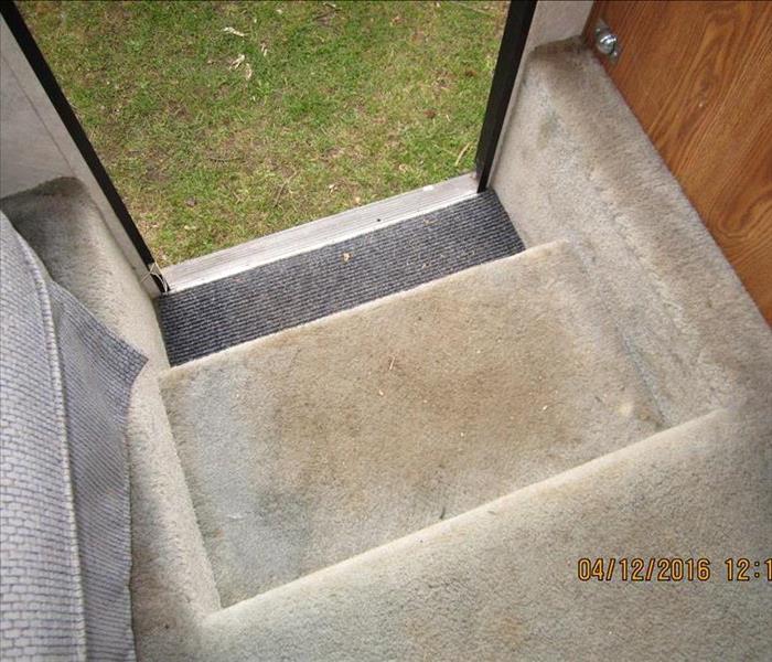 Steps from an RV with dirt on them